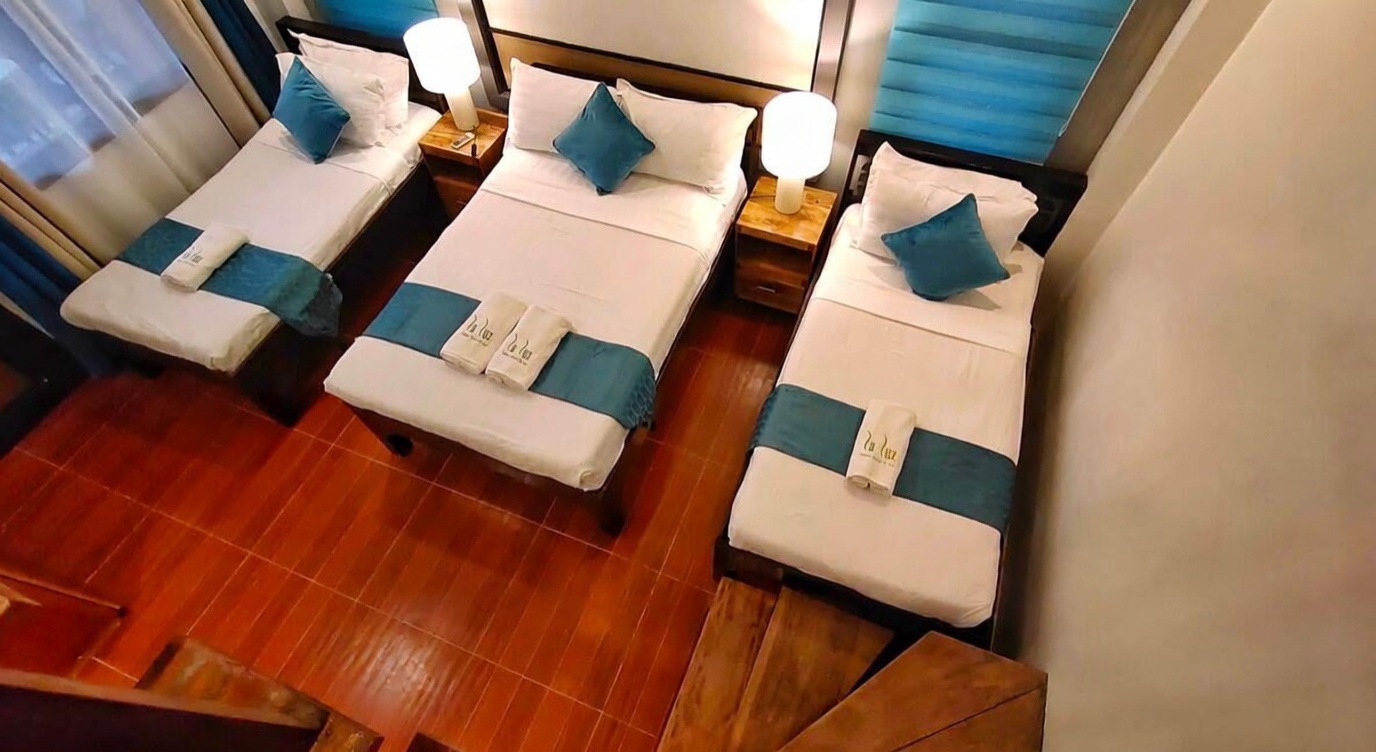 Annex loft room bed at La Luz Beach Resort