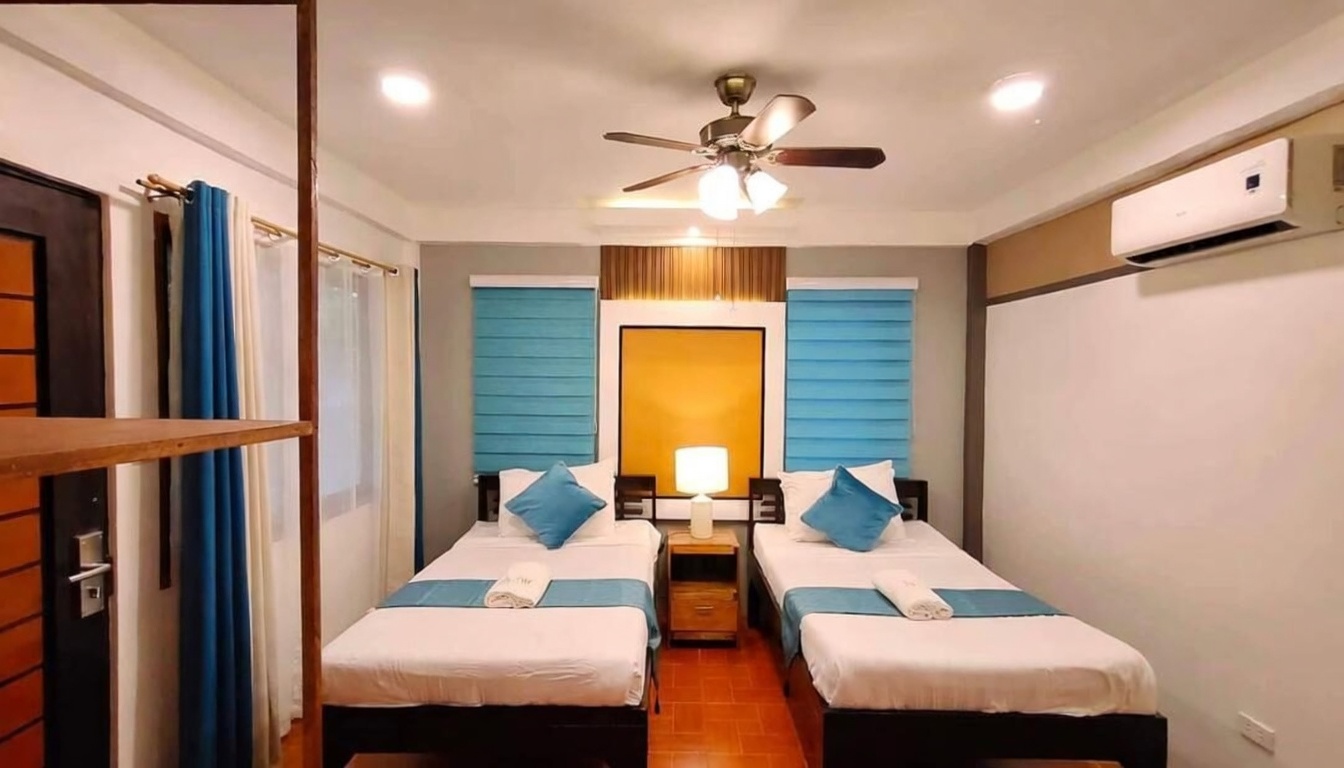 Annex room bed at La Luz Beach Resort